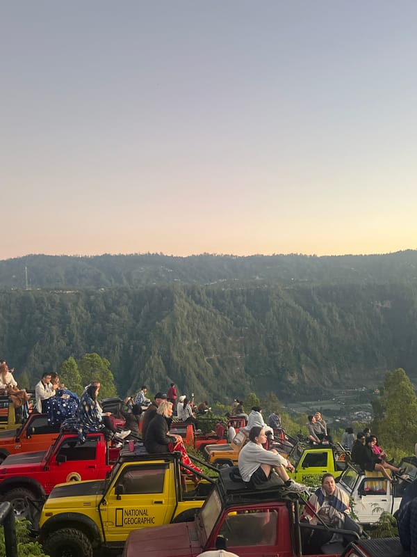 Sunset from jeep rooftops over Kintamani's volcanic valley