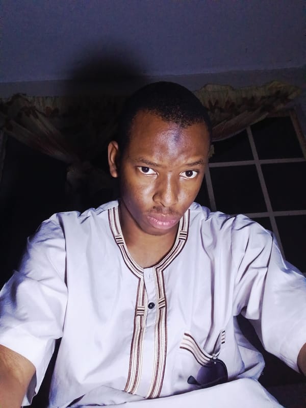 Lagos portrait session mixes traditional fits, sunglasses, and personal graphics