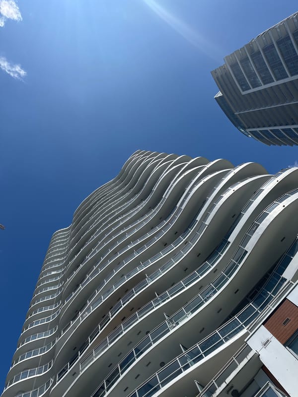Wave-shaped condo and rope-access work in Surrey