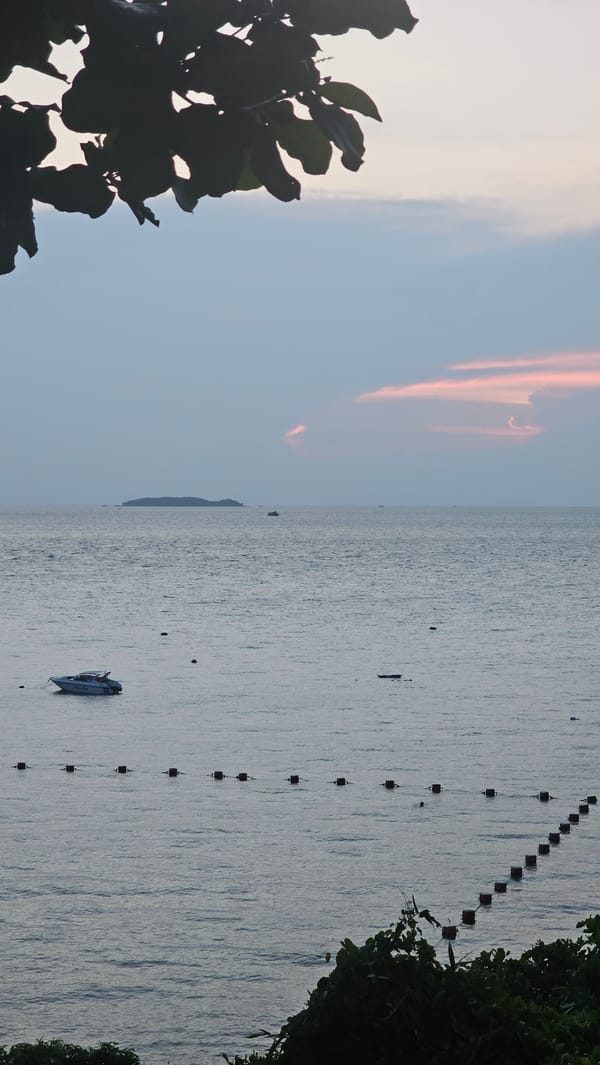 Tourist documents sunset dining experience in Pattaya, Thailand