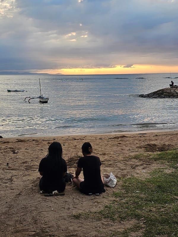 Evening beach gathering observed in Denpasar during sunset
