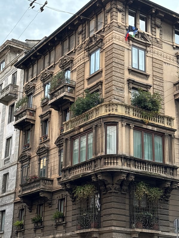 Witness documents Milan architectural facades during evening walk