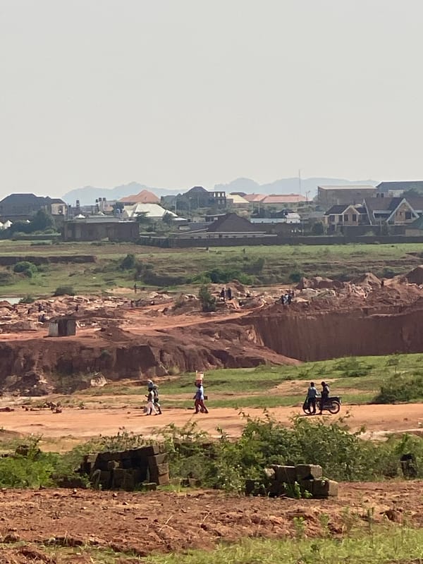 Open-pit mining operations spread across the Jos Plateau