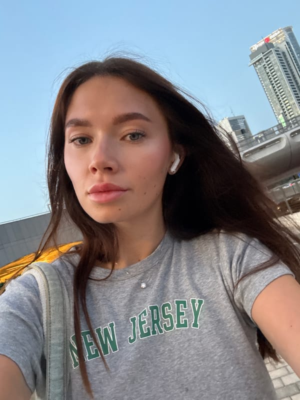 Woman takes selfie with earbud in Tel Aviv