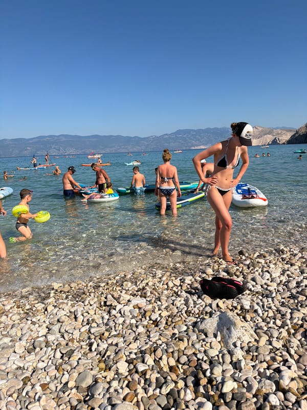 Sunny afternoon on the pebble beaches of Baška, Croatia