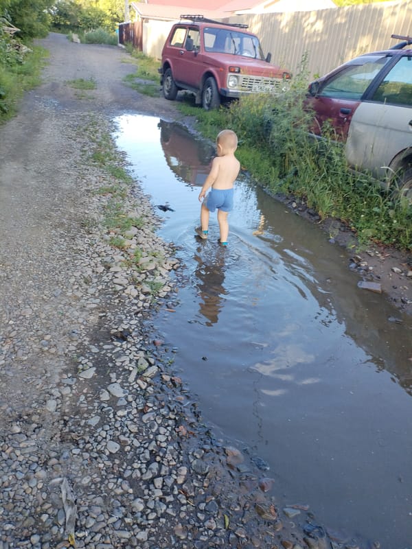 Summer morning puddle play in Komsomolsk-on-Amur