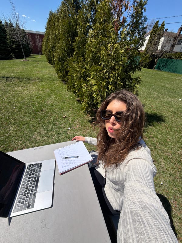 Woman sits at outdoor table in Longueuil