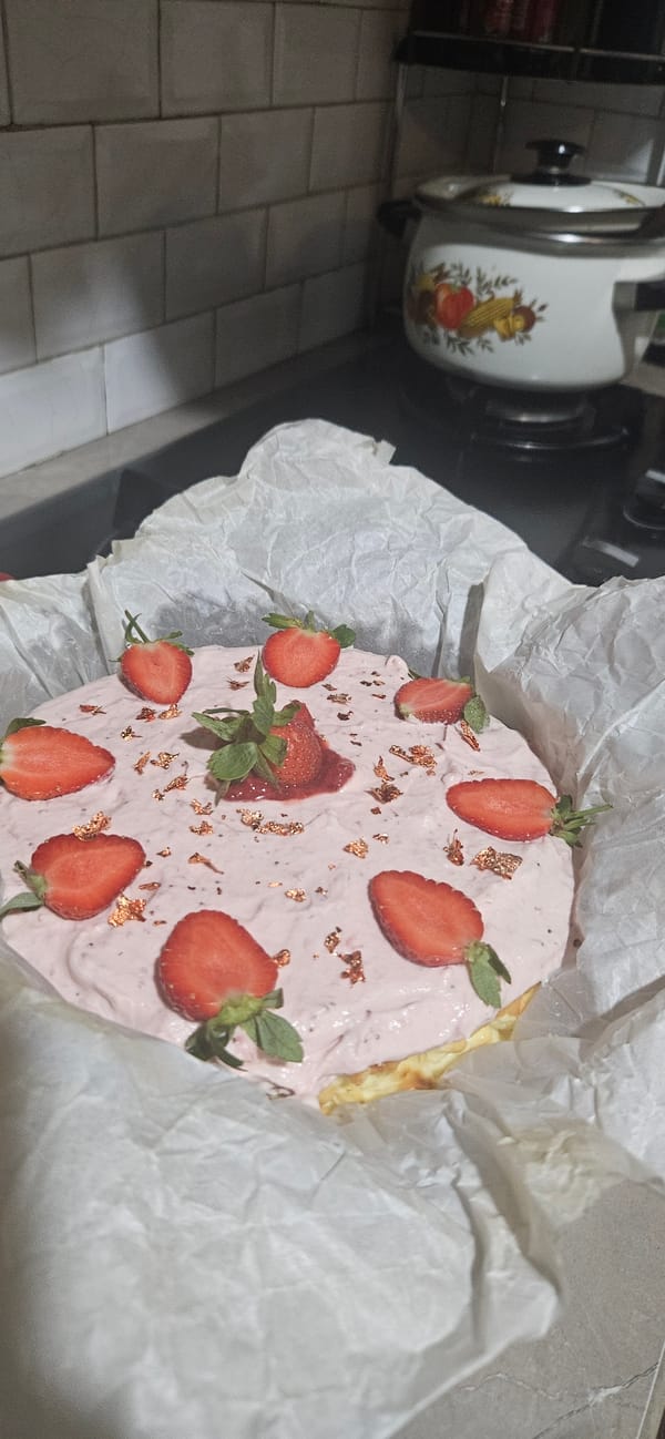 Catered spaghetti and strawberry cheesecake prepped in Bekasi