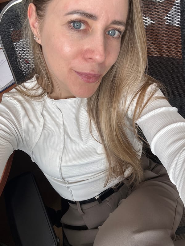 Woman photographed in office setting in Chaikovsky, Russia