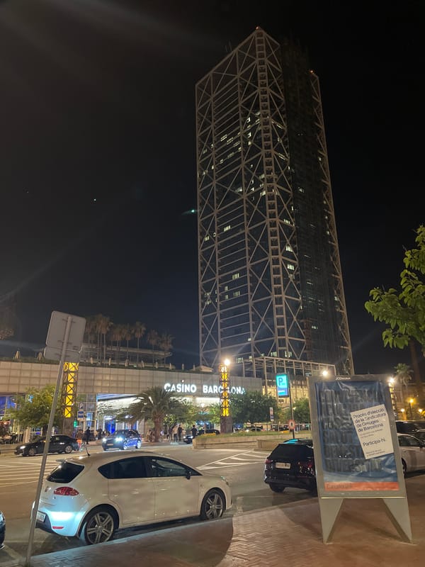 Barcelona Port Olímpic nightlife draws crowds around illuminated landmarks