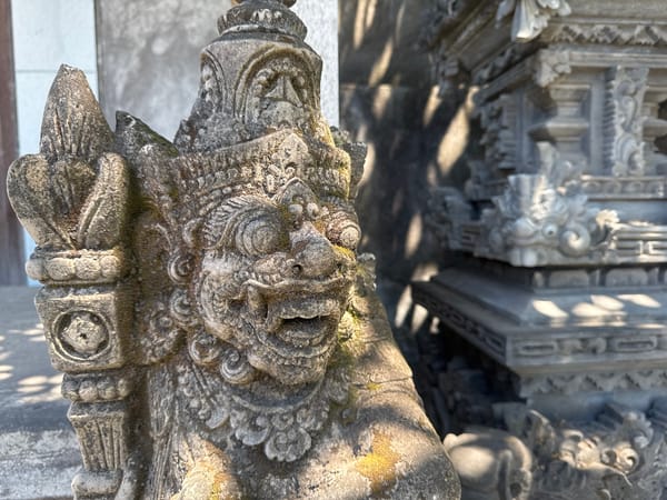 Traditional Balinese temple carvings documented in Kubu, Indonesia