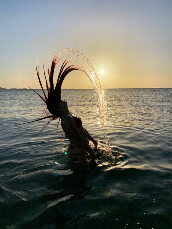 Woman enjoys sunset beach activities in Juan Griego Venezuela