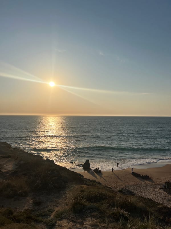 Sunset along the Cascais coast, cliffs and open beach