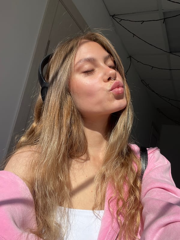 Woman in headphones poses for kiss photo in Russia