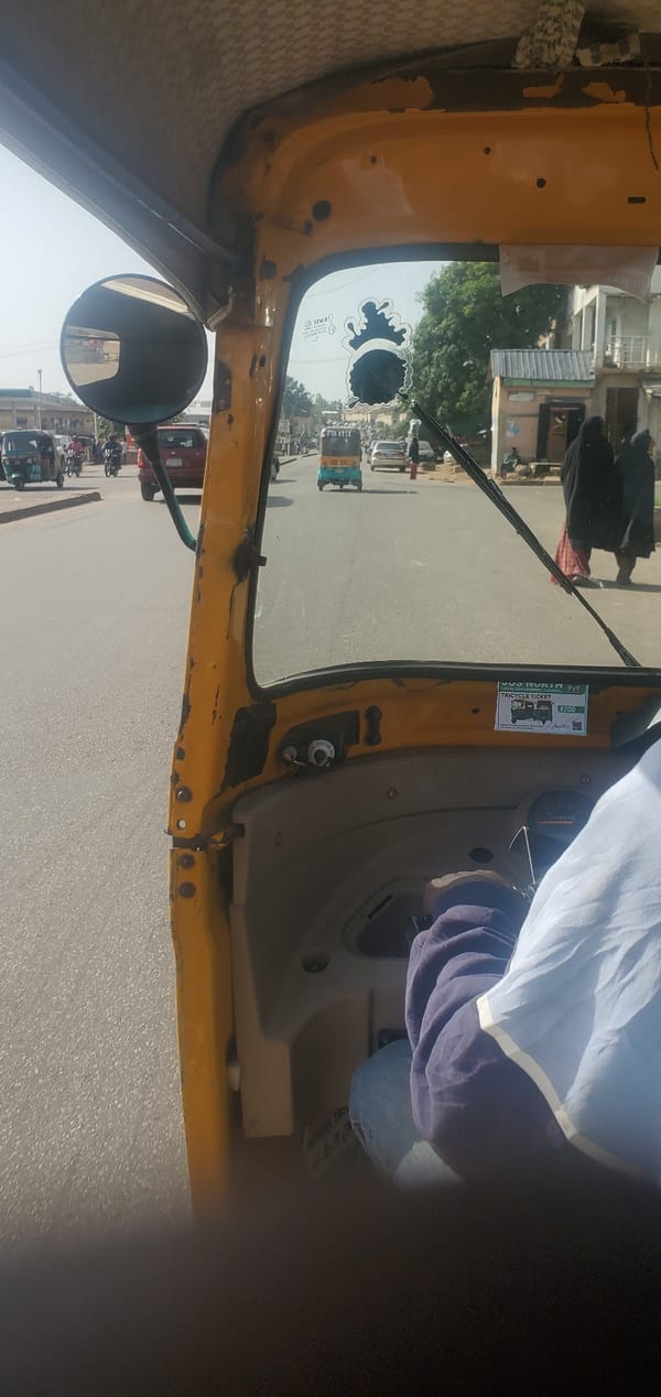 Midday street life and traffic across Jos, Nigeria