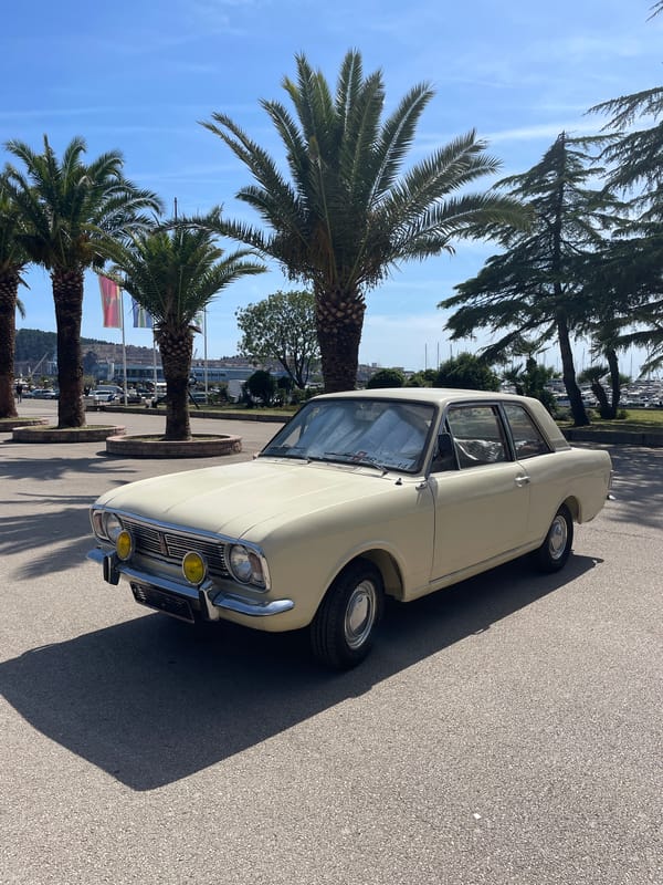 Vintage car and coastal promenade documented in Bar, Montenegro
