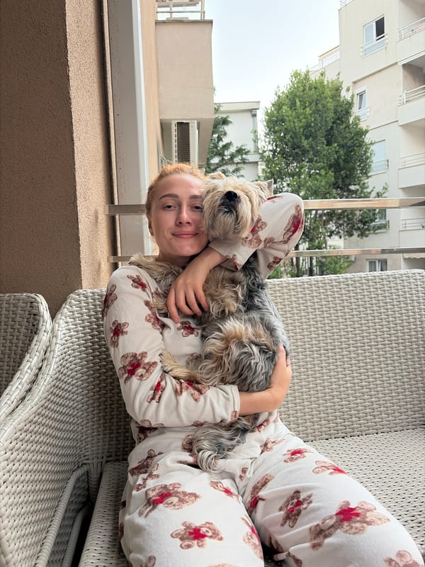 Couple enjoys quiet afternoon at Budva home with fruit, pets