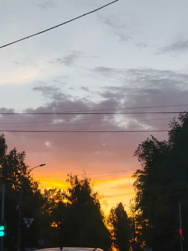 Evening life unfolds in Chaikovsky during spectacular sunset