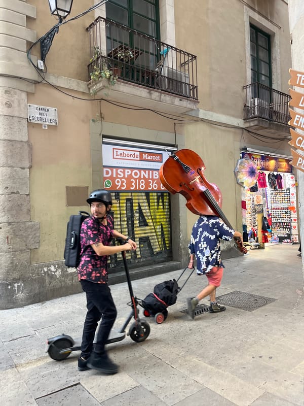 Two men pose for cameras on Barcelona streets