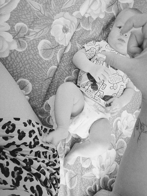 Early morning baby care moments documented in Tobolsk home