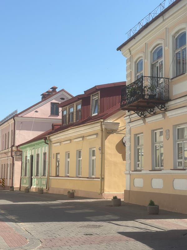 Street-level views of European-style architecture and cobblestone streets