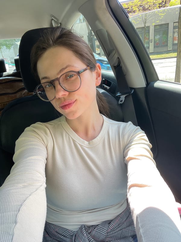 Woman takes selfie inside car in Budapest