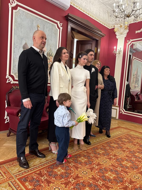 Formal gathering documented in ornate Moscow interior space