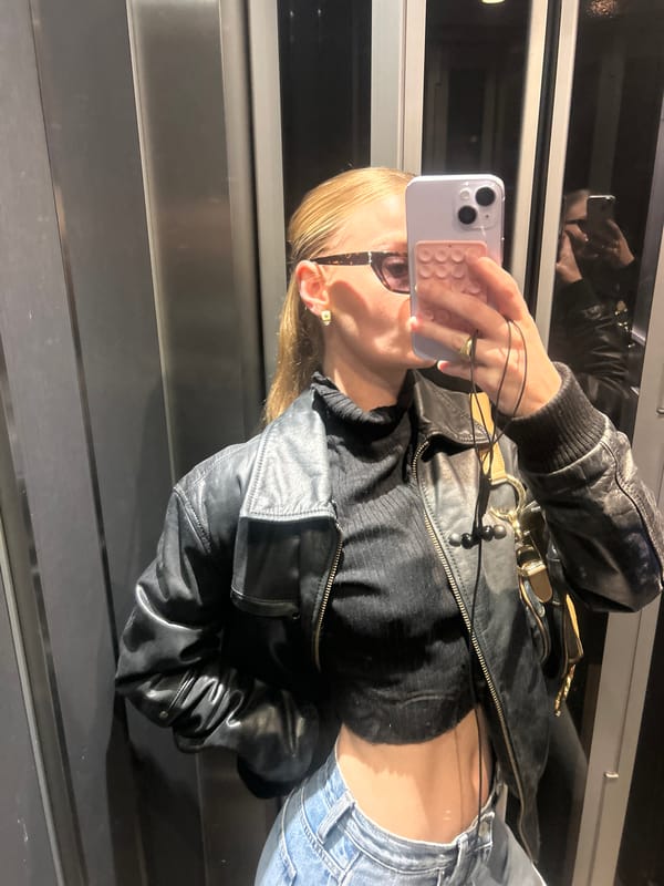 Person Takes Elevator Selfies in Black Leather Jacket