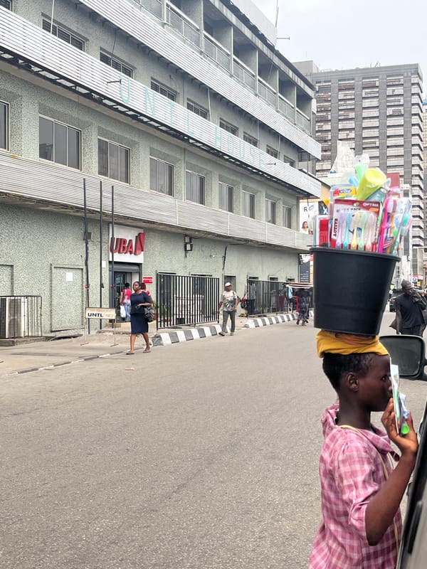 Daily street life captured around Lagos bank branch