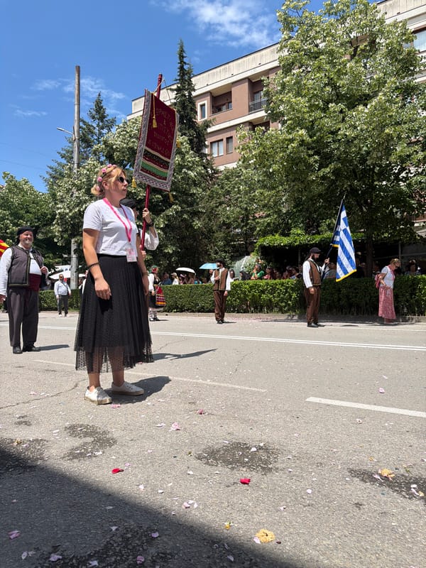 Traditional street parade with costumes and puppets in Bulgarian cities