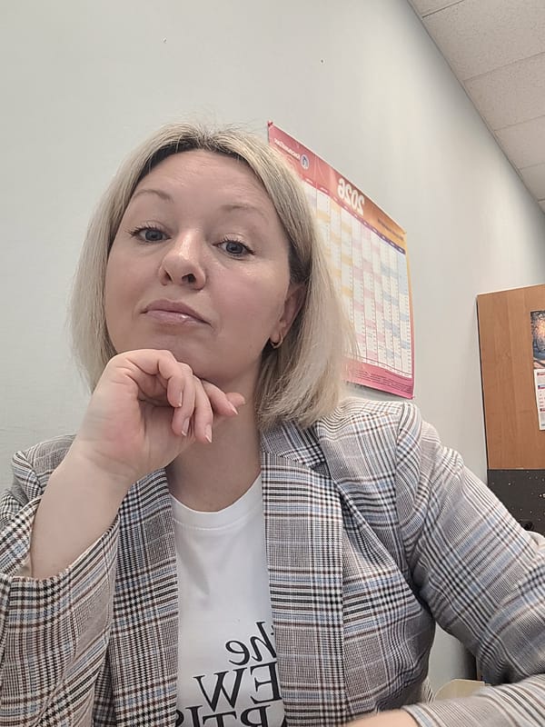 Woman takes playful selfies in Izhevsk office