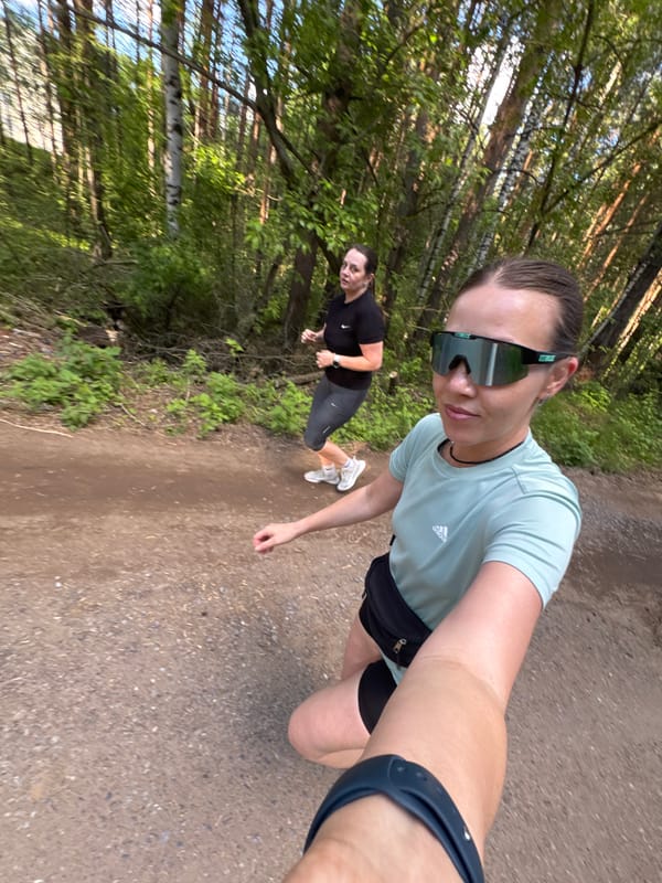 Women exercise on forest trail in Chaikovsky, Russia
