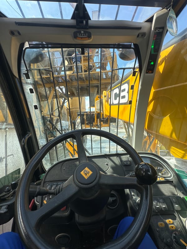 Construction worker operates JCB vehicle in Yambol, Bulgaria
