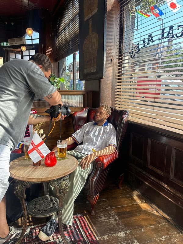Man photographs England shirt mannequin in London pub