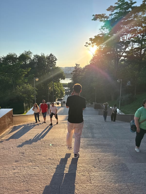 Golden hour in a Chișinău park, lakeside paths and staircases