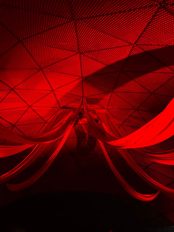 Red-lit dome venue in Žemaitkiemis hosts an evening gathering