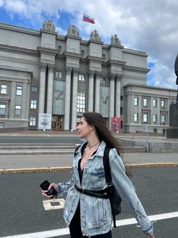 Outside a classical building with a statue, Novokuybyshevsk