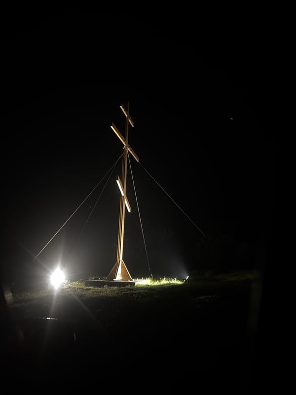 Illuminated wooden structure suspended by wires observed in Konstantinovo