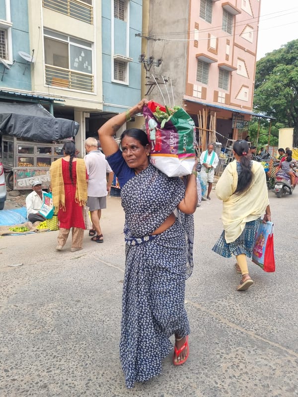 Street vendors operate morning vegetable market in Puttaparthi, India