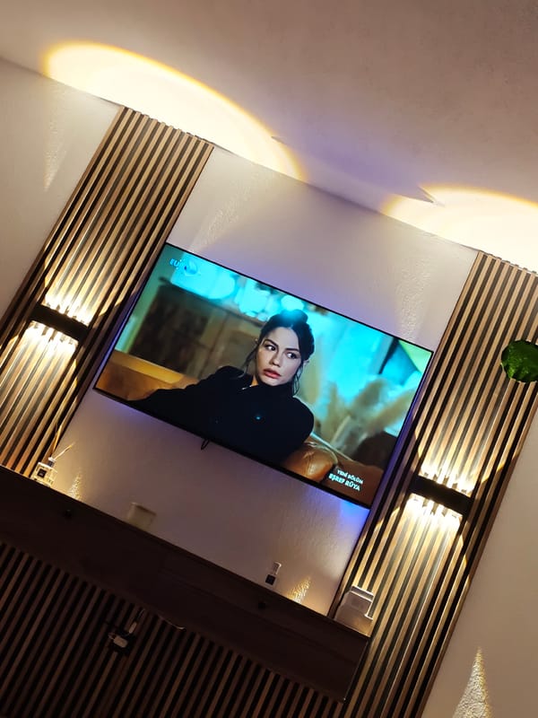 Television displays woman's image between decorative panels in Bulgaria