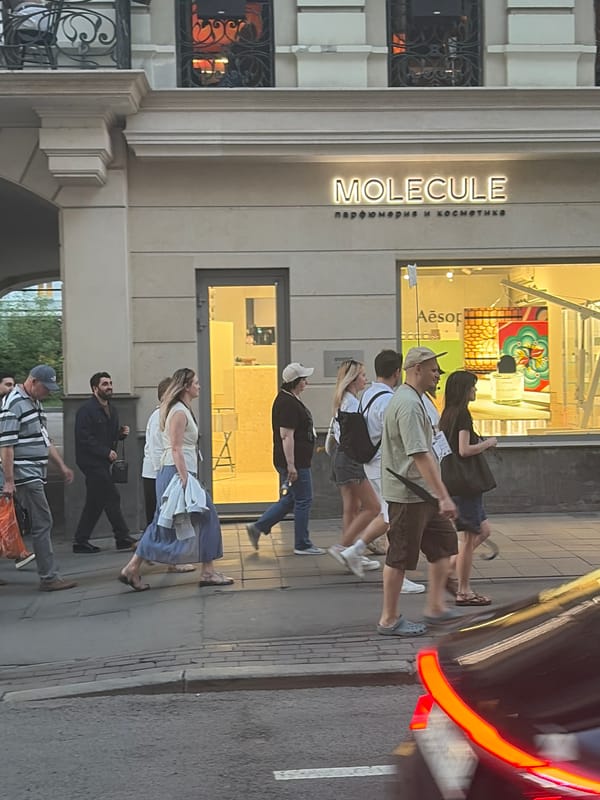 Urban street life documented across commercial district during evening hours