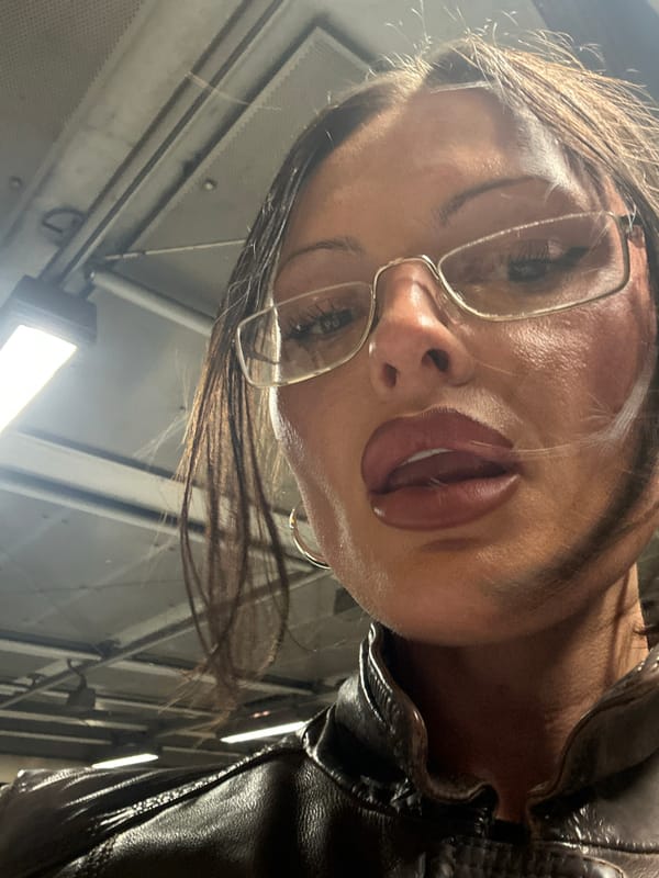 Portrait of glasses-wearing person in leather jacket captured in London