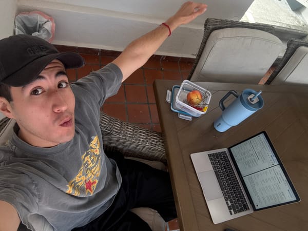 Man observed at outdoor table, later opening candy indoors