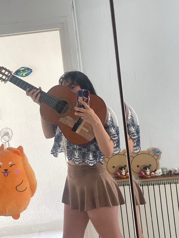 Mirror selfie with acoustic guitar in Canet de Mar