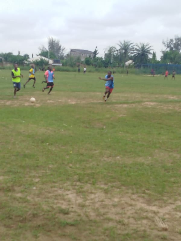 Soccer game observed on field in Ikot Mbonde, Nigeria