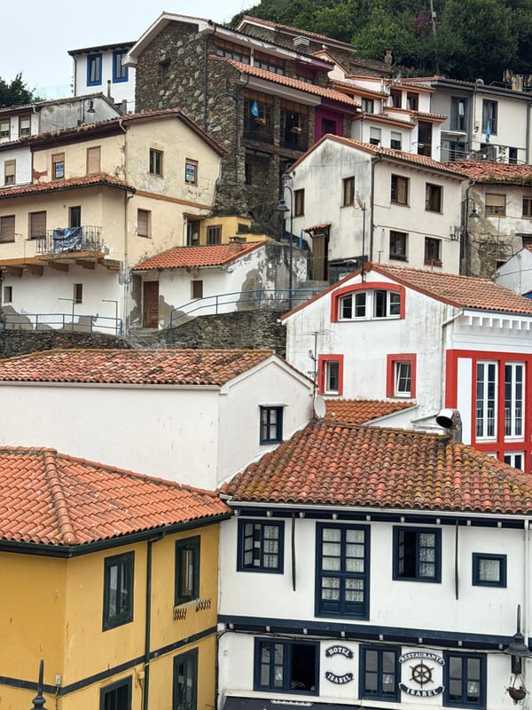 Inside Cudillero's stacked streets, colorful facades, and harbor waterfront