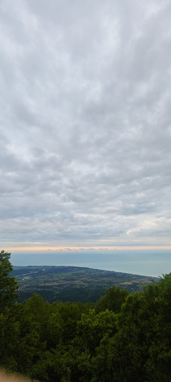 Tourist photographs coastal scenery from Abkhazia lookout point