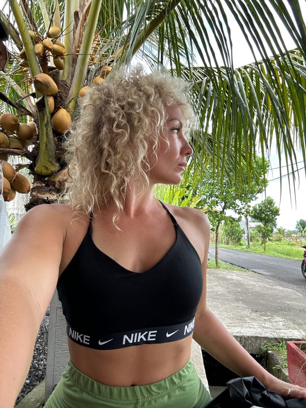 Woman in athletic wear spotted near palm tree