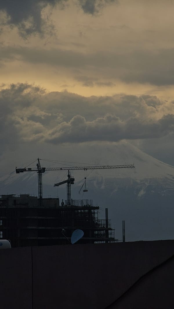 High-rise construction continues under overcast skies in Puebla