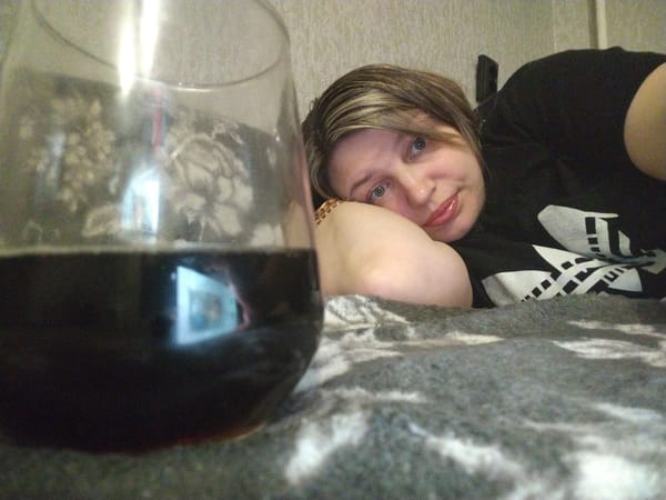 Woman resting on bed observed in Yaroslavl, Russia